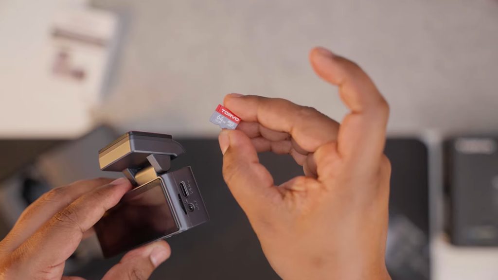 TORVO TD3 Dashcam and memory card in hand 
